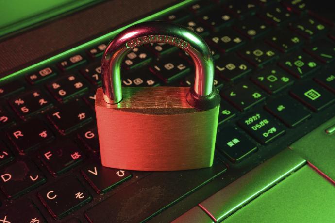 red padlock on black computer keyboard